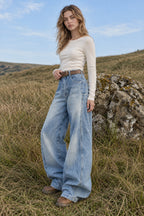 Curved Cut Wide Leg Distressed Jeans