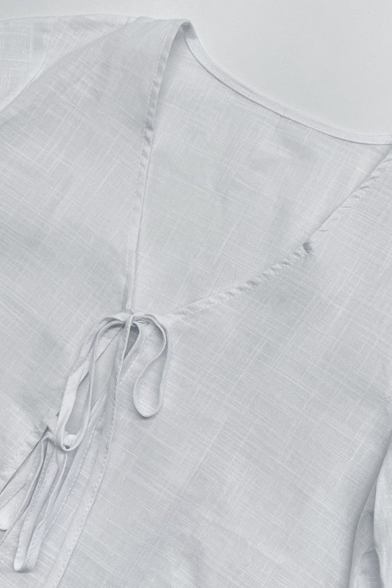 Plunging V-Neck Cotton Blouse with Flared Sleeves